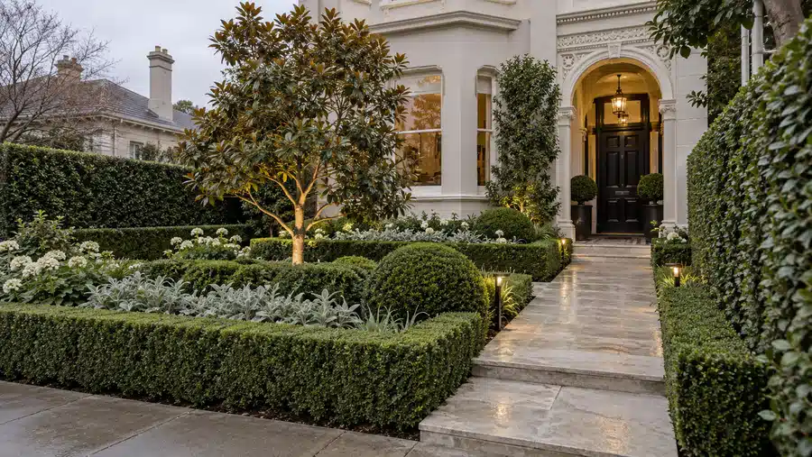 Structured period home front garden with stone path